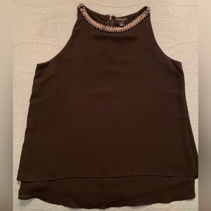 Women’s sleeveless blouse with rhinestone neckline